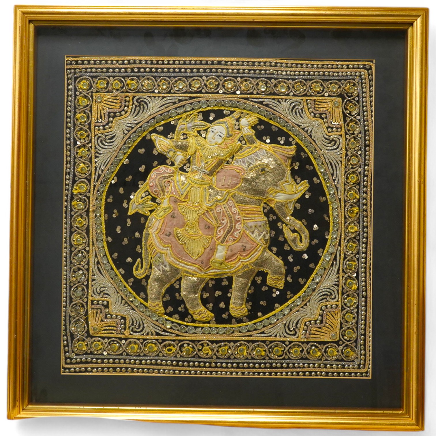 An Indian stumpwork panel of a figure and elephant